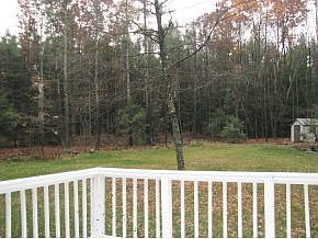 Deck overlooking backyard