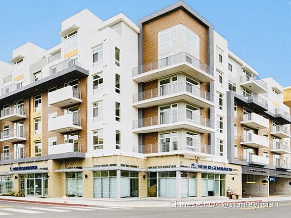 high-end mixed use building with coffee shop, fitness studio, noodel house, etc. on the ground level