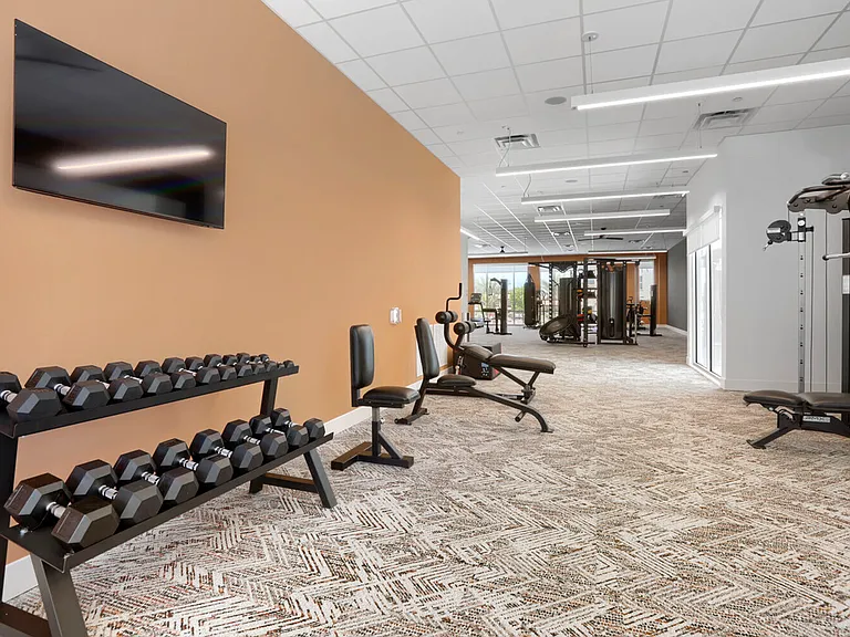 Everything you need to crush your goals. From dumbbells to cable machines, the Garrett Uptown fitness center rivals any commercial gym in Chandler.
