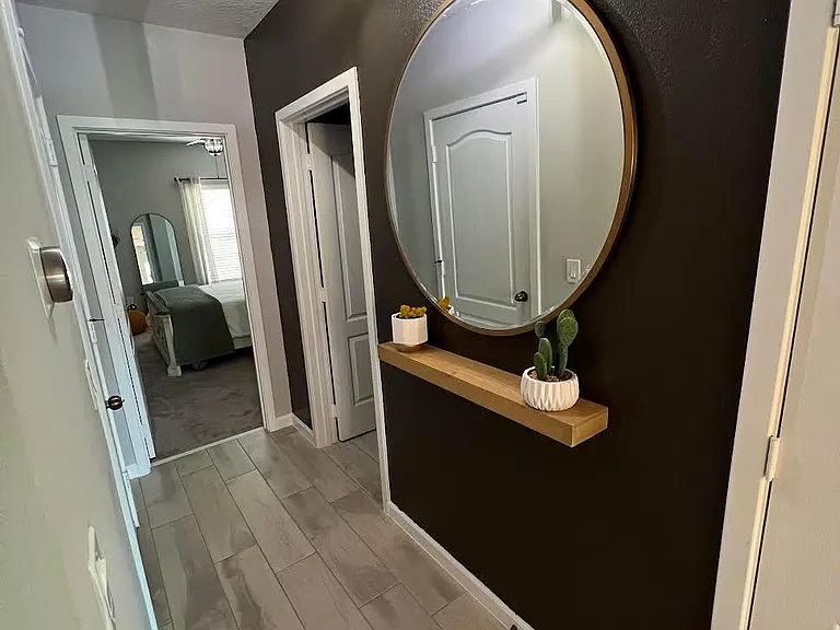 Hallway area with modern light fixture