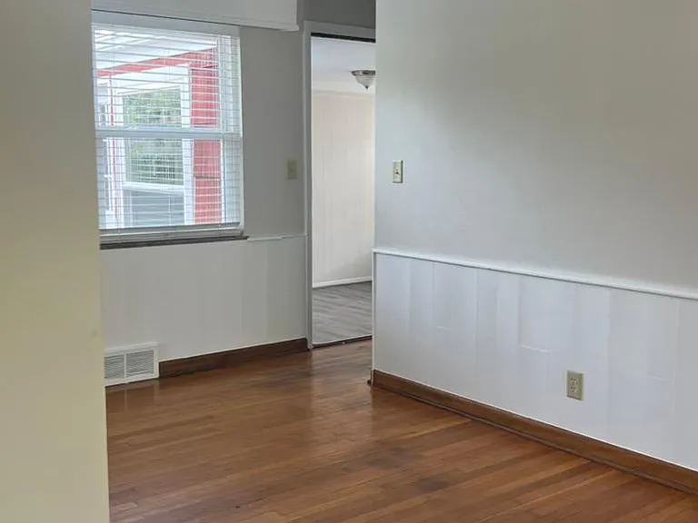 Dining area looking into breezeway den/office