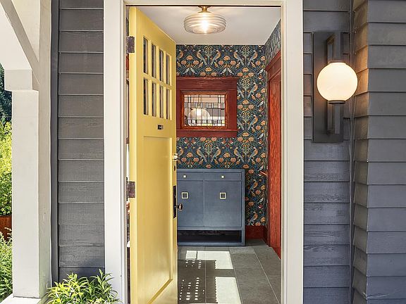 Beautifully designed entrance with thoughtful touches, seating and shoe storage.