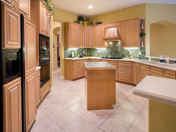 Beautiful kitchen features huge breakfast bar and center island.