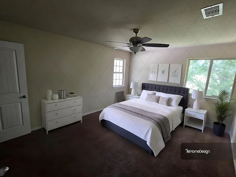 Spacious bedroom with a queen bed, dual nightstands, dresser storage, ceiling fan, and large windows with treetop views.
