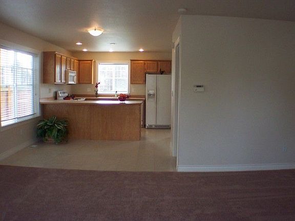 Bright and airy kitchen area is open to family room, new carpet too!