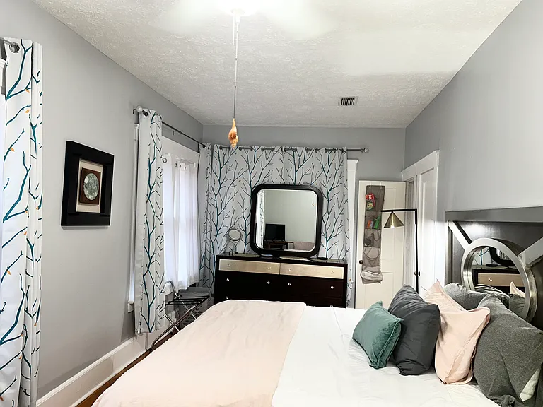 Large long primary bedroom with KING size bed.