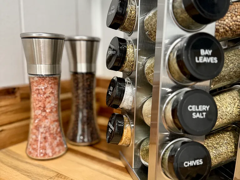 The 16-jar spice rack and beautifully smooth salt and pepper grinders add both convenience and elegance to your kitchen essentials.