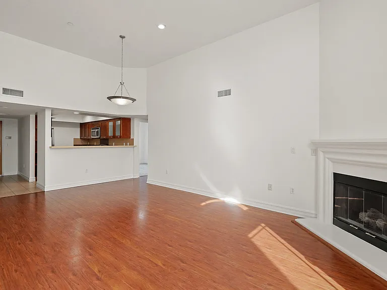 Open-Concept Dining and Living Room with a Fireplace