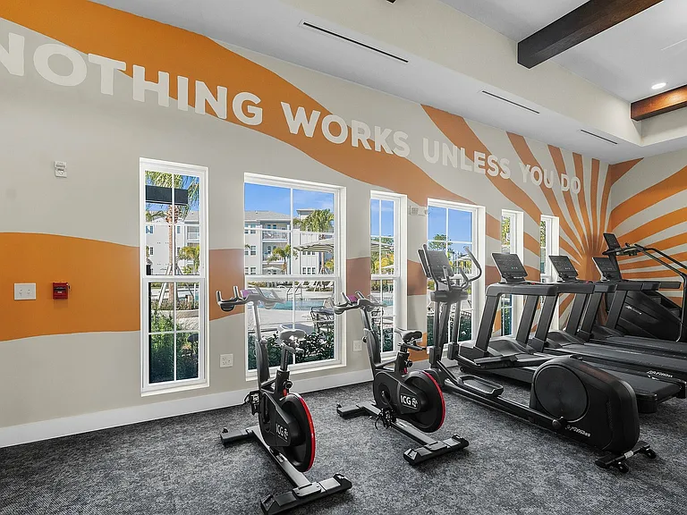 Elevate your fitness journey in this vibrant apartment gym, designed for motivation and energy.