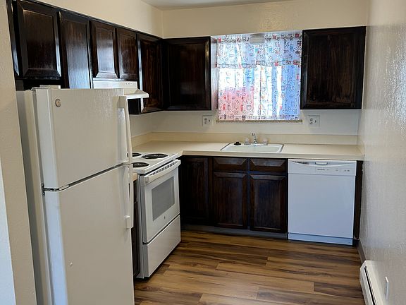 Kitchen with new LVP flooring, paint and all new appliances.