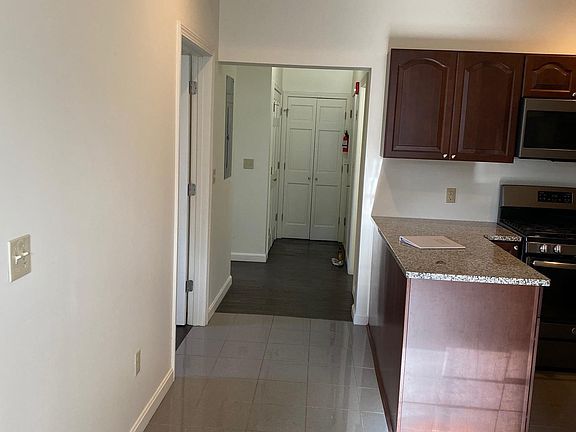 Hallway to entry and laundry room.