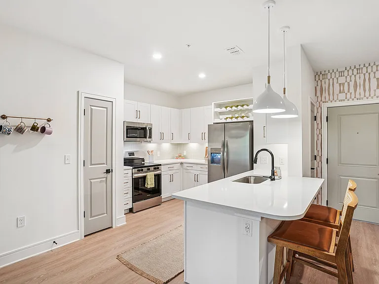 Kitchen with Quartz Countertop and Stainless Steel Appliances.