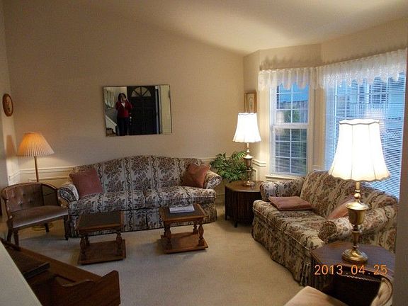 Formal Living room, wainscoting and lots of natural sunlight for your enjoyment.
