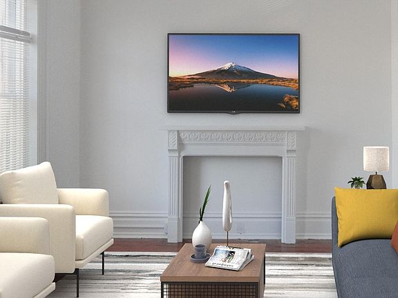 Living room with high ceiling and ceiling fan