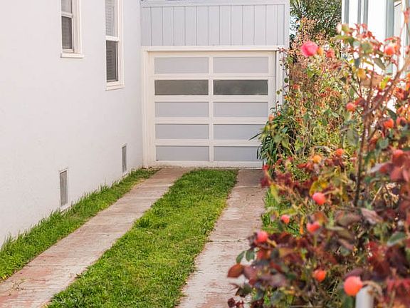 side walk to enclosed garage