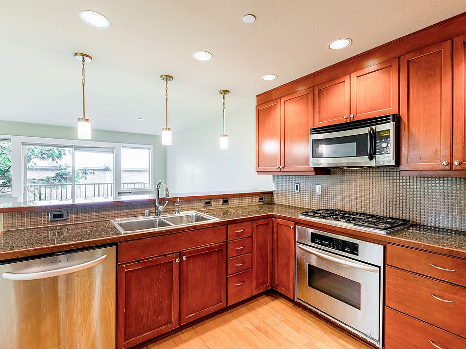 The kitchen has ample cabinet and counter space.