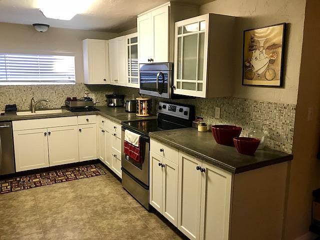 Concrete countertops and fully stocked kitchen