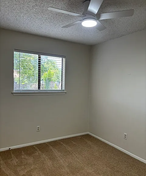 Front Bedroom on the right with exterior window facing the side yard area. Closet is to the left, but is not shown in the photo.