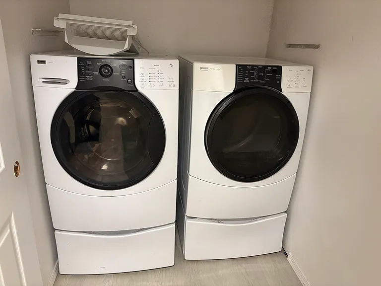 2 Formal Laundry rooms, one level each, 
Kenmore washer and dryer at upper level in one of the two laundry rooms