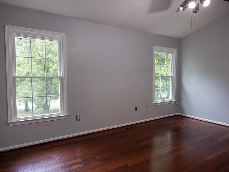 master bedroom with cathedral ceiling.