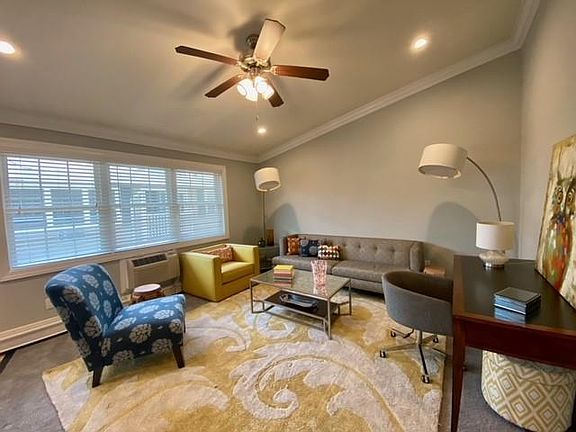 Gray Wall Paint with White Crown and Base Molding