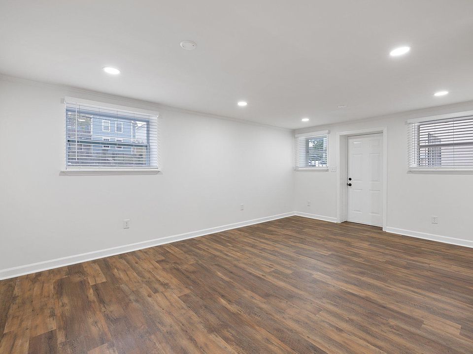 Large living room with lots of natural lighting from windows