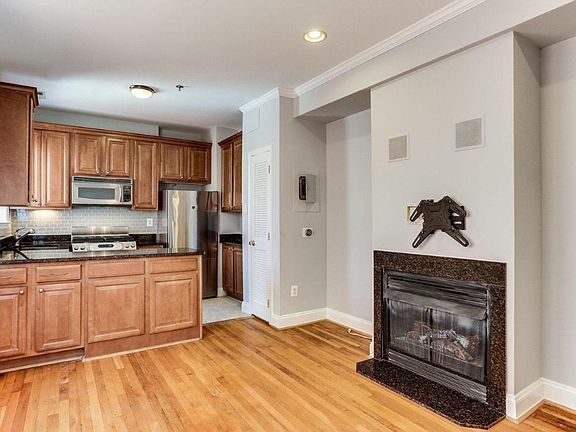 Gas fireplace in the hardwood floor open living/dining room