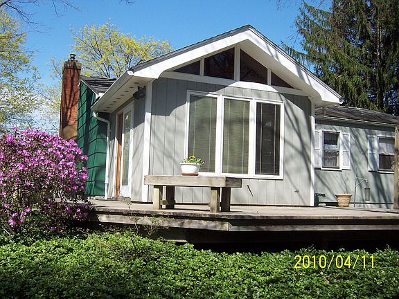 Wrap around deck and three season sunroom