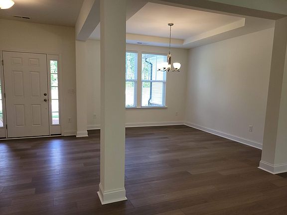 Open floor plan, LVP flooring throughout 1st floor. Tray ceiling in Dining room