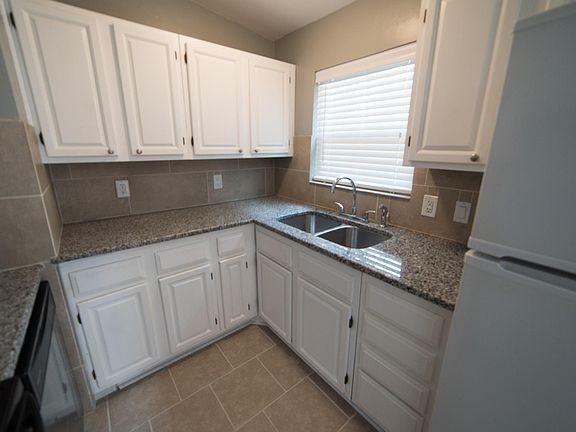 Kitchen is fully renovated, featuring brand new granite and 