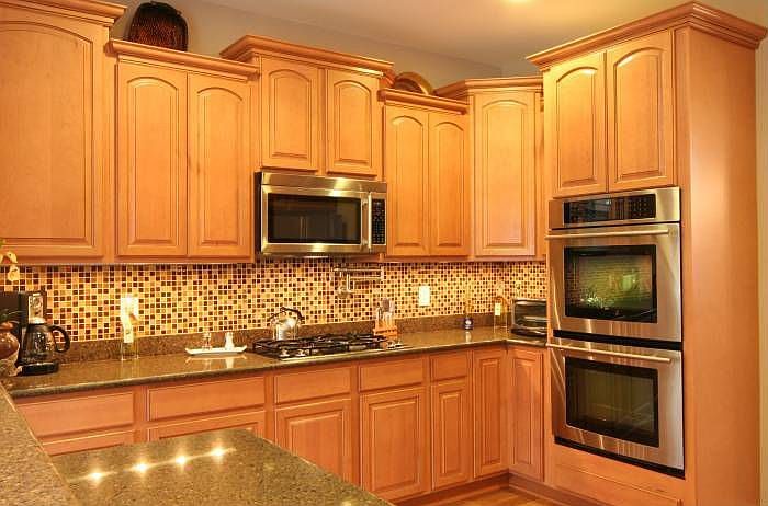 Pot filler above cooktop