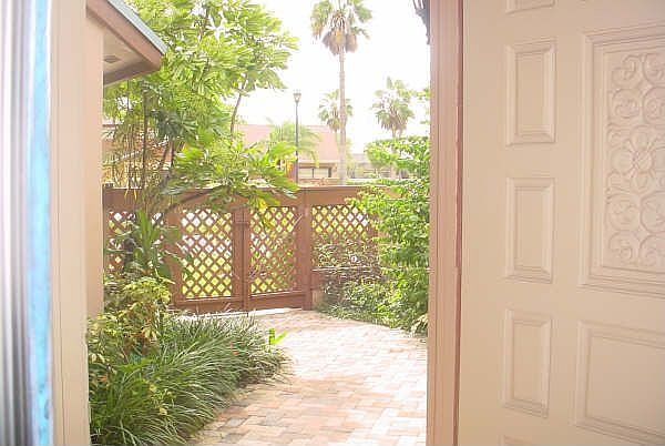 Lush vegetation and beautiful brick walkway