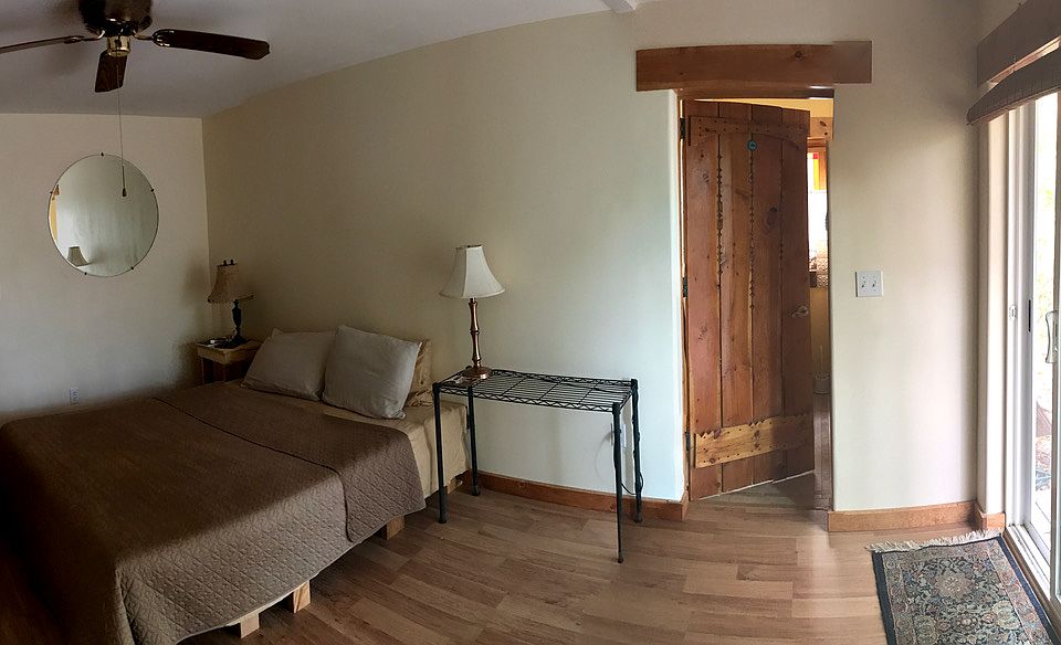 Space for a queen, two desks/office space, armories, room divider, breakfast dining table, optional shelves, and floor space to move. In the great room.