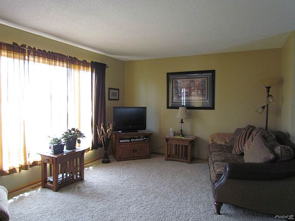Spacious living room w/lots of  natural light!