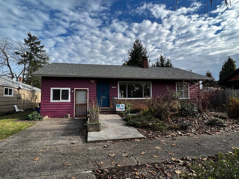 Home exterior. There is a small step up to the front sidewalk. The white door to the left of the photo goes to a private bedroom & bath. The blue door goes to the main house.