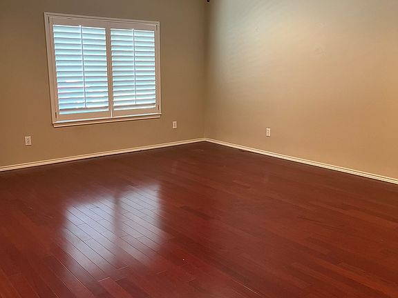 Plantation shutters on all windows. This window is in living room looking out to street