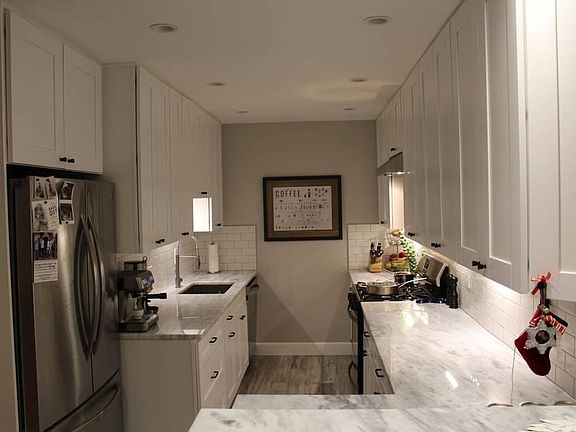 newly renovated gourmet kitchen with new stainless steel appliances