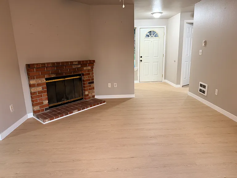Living room to main door. Coats closet is to the left