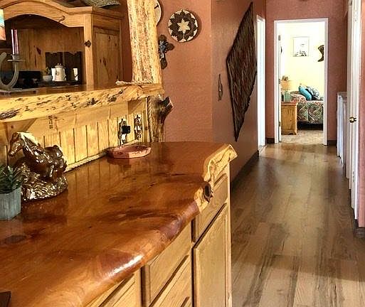 Hand crafted buffet and hallway to bedrooms.