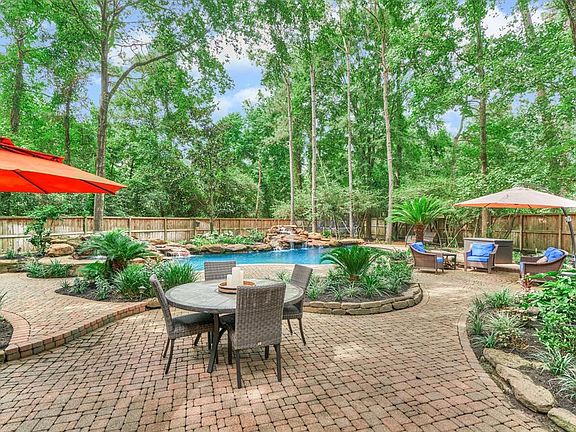 There are so many multiple outdoor areas to enjoy and relax poolside. The lot is very large and private and has space for everyone. The trampoline can remain with the home!