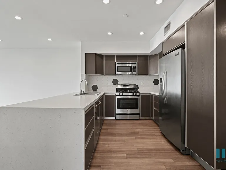 Full-Size Kitchen with Stainless-Steel Refrigerator, Stove, Microwave Oven, and Dishwasher