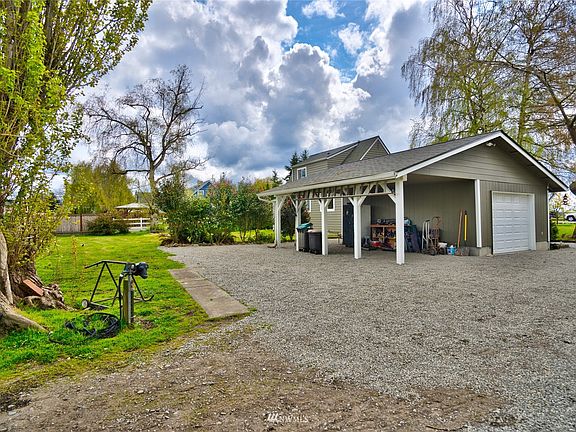 Heated garage and attached car port + additional parking area.
