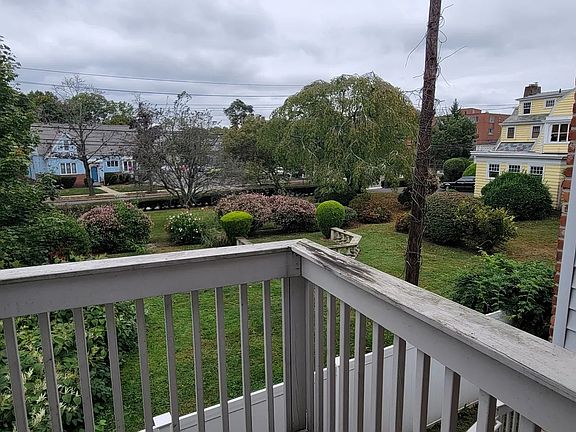 Private balcony overlooking West Haven Historical Society's garden