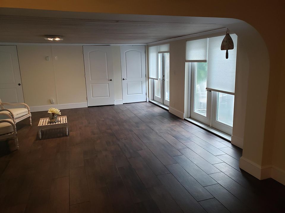 Beautiful 400 square foot room with porcelain plank tile floors. 
Looks out pool with deck
And outside sitting area on the other side
4 large dbl doors
