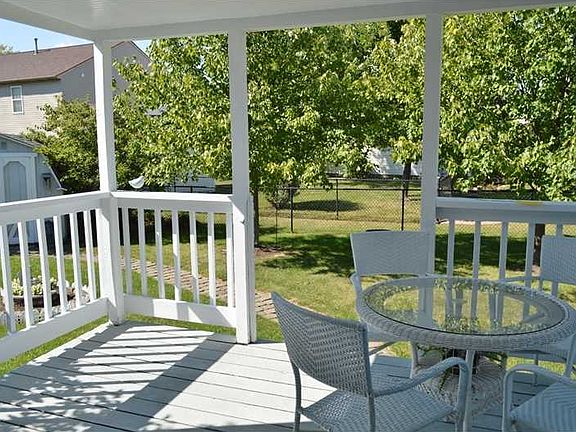 Exterior Back. Super rear covered patio & lush lawn. Note barn in back.