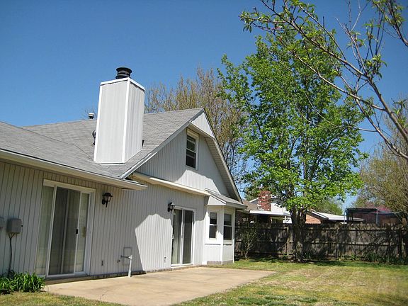 Mature tree, chimney, back of house