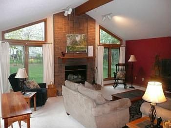 Beautiful family with vaulted ceilings, brick fireplace and many windows from which you can view the
