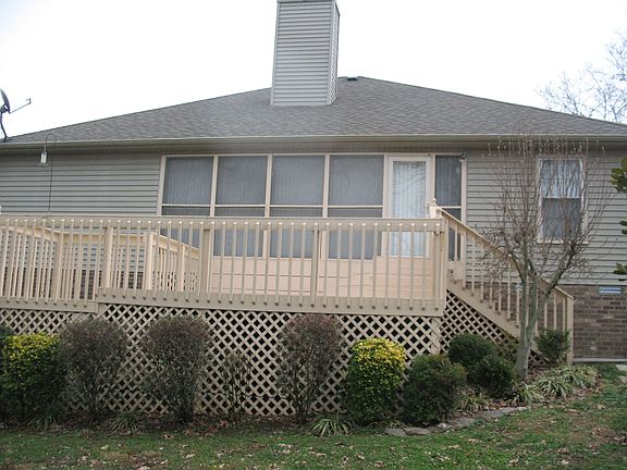 Back view of deck and sun room.
