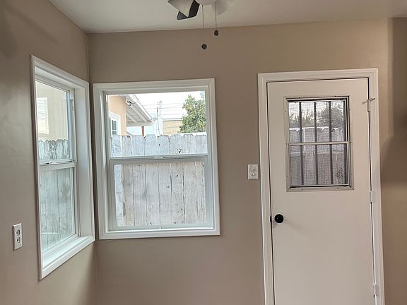 Kitchen with backdoor to Backyard