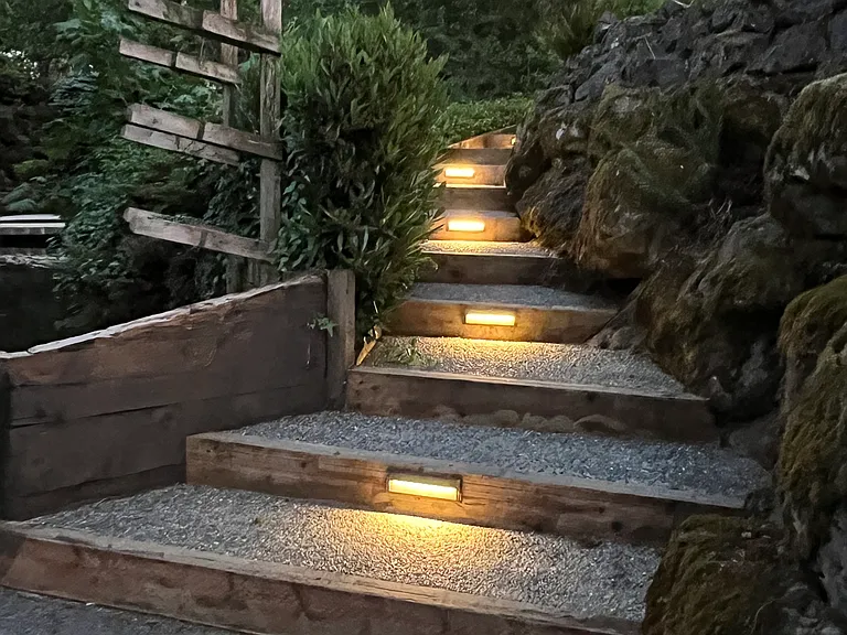 Lighted steps with kayak storage.